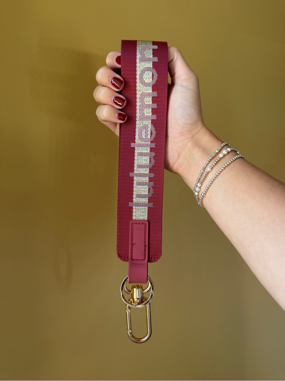Lululemon Maroon Key Chain with Gold Hardware